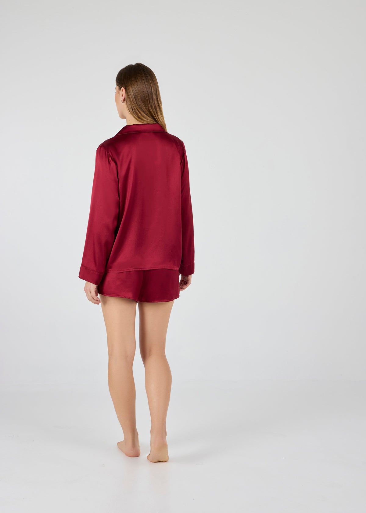Back view of A.ROSE Chloe Set in dark red washable silk – elegant loungewear and/or set featuring a relaxed-fit button-down top and flowy shorts with a soft elastic waistband. Perfect for bridesmaids, gifting, or everyday elevated comfort.