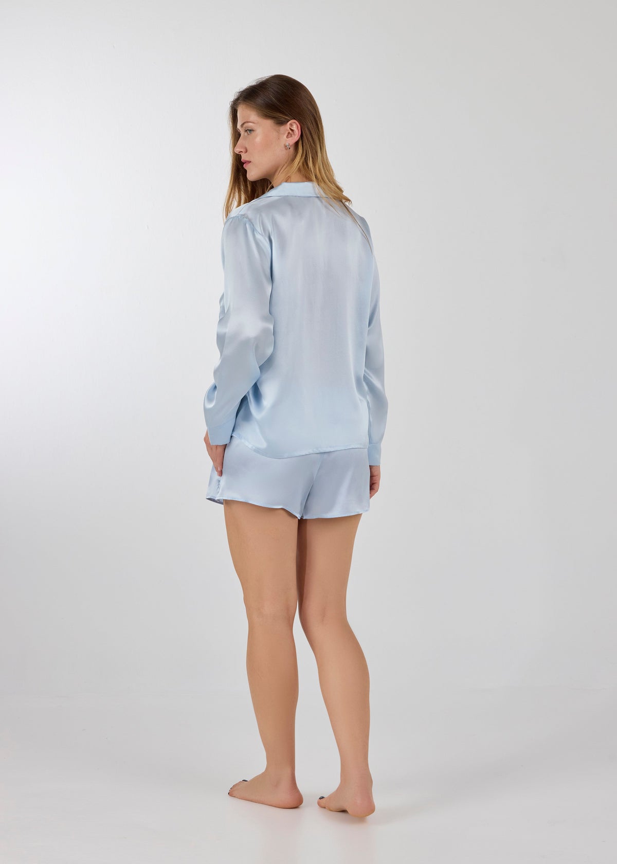 Model wearing A.ROSE Chloe Set in ice blue washable silk – elegant and elevated loungewear and/or sleepwear for women